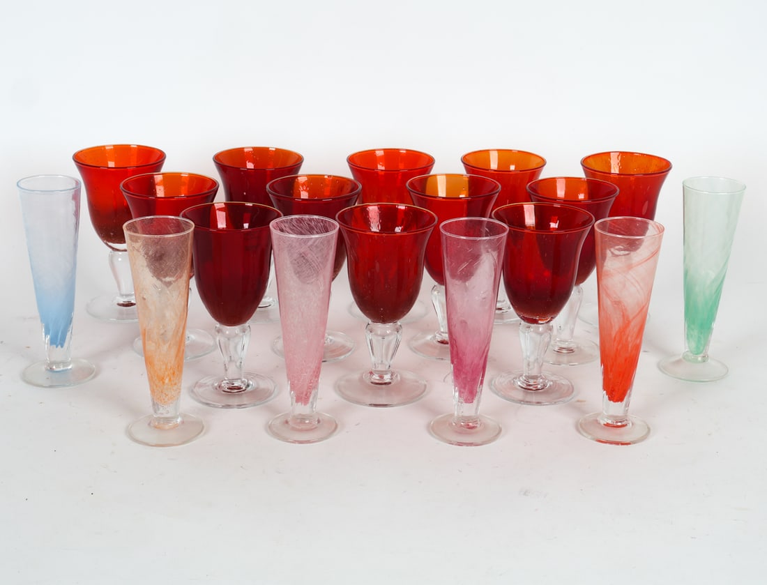 VIETRI COLORED GLASS STEMWARE GROUPING: Includes (12) glass goblets and (6) glass flutes. Apparently unmarked. Dimensions: Flutes H 8.25". Goblets H 7.25". Condition: Minor scuffs, wear consistent with gentle use.