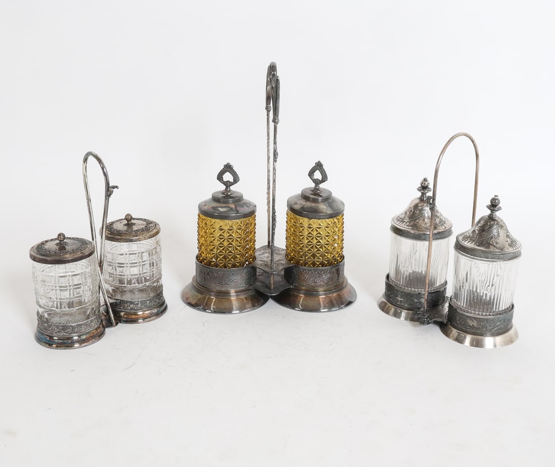 GROUPING OF VICTORIAN DOUBLE PICKLE CASTORS: Dimensions: (largest) H 13" x W 9" x D 5" Condition: With varying stages of wear including small chip to rim of one castor and oxidation to silverplate consistent with age and use.