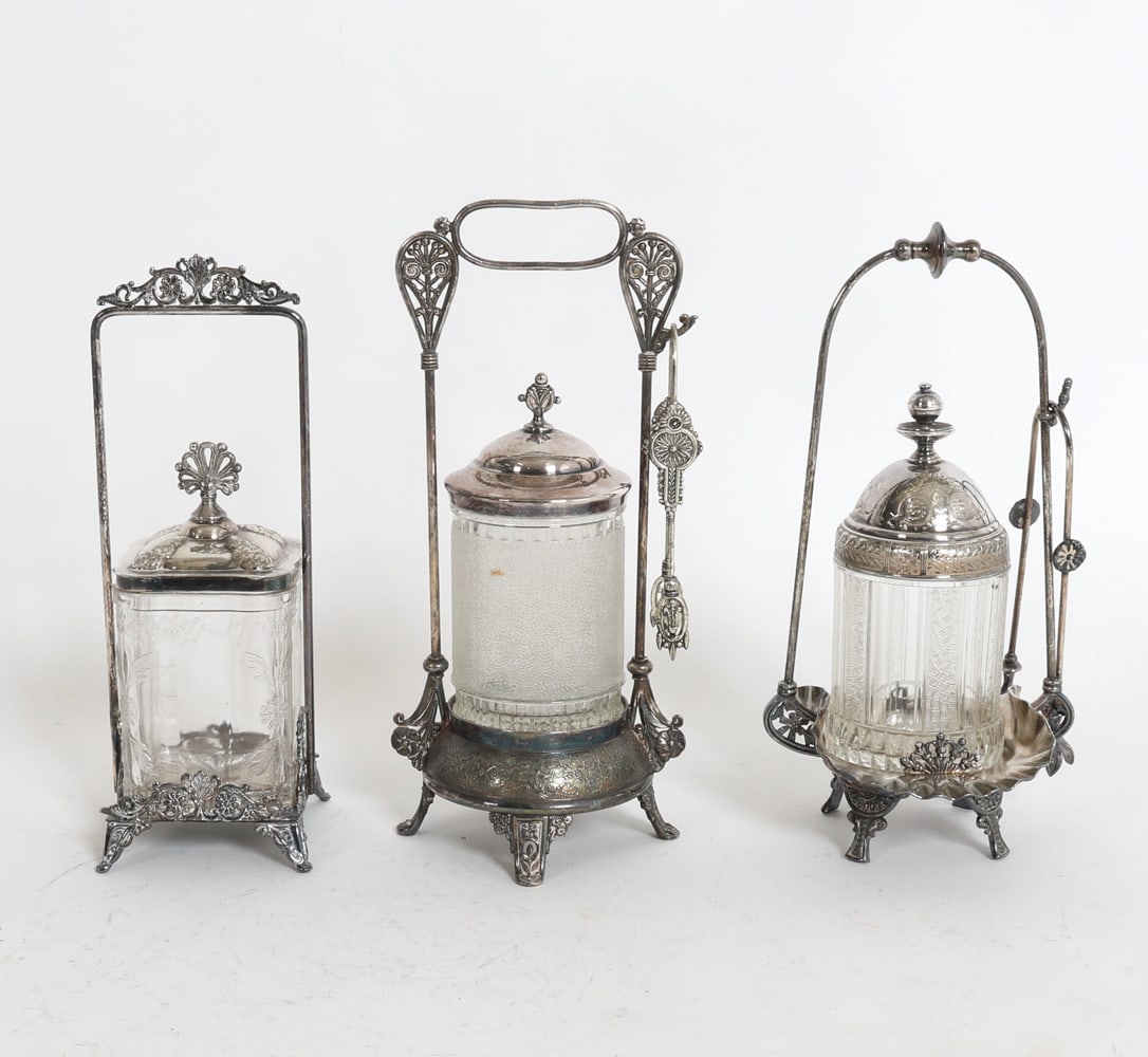 GROUPING OF VICTORIAN PICKLE CASTORS: Dimensions: (largest) H 11.6" x W 6" x D 5" Condition: Showing signs of wear including oxidation to metal elements and cloudiness to glass consistent with age and use.