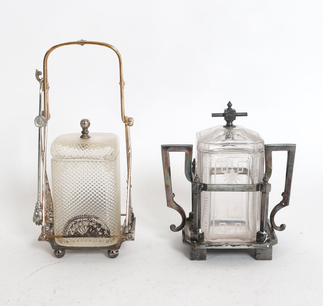 VICTORIAN CRYSTAL GLASS PICKLE CASTOR GROUPING: (2) Crystal glass pickle castors in silver plated holders. Stamped Rogers Smith & Co. underneath. American, circa 1880s. Dimensions: (taller) H 10" x W 4.5" x D 3.5". Tongs L 7.75". Condition: