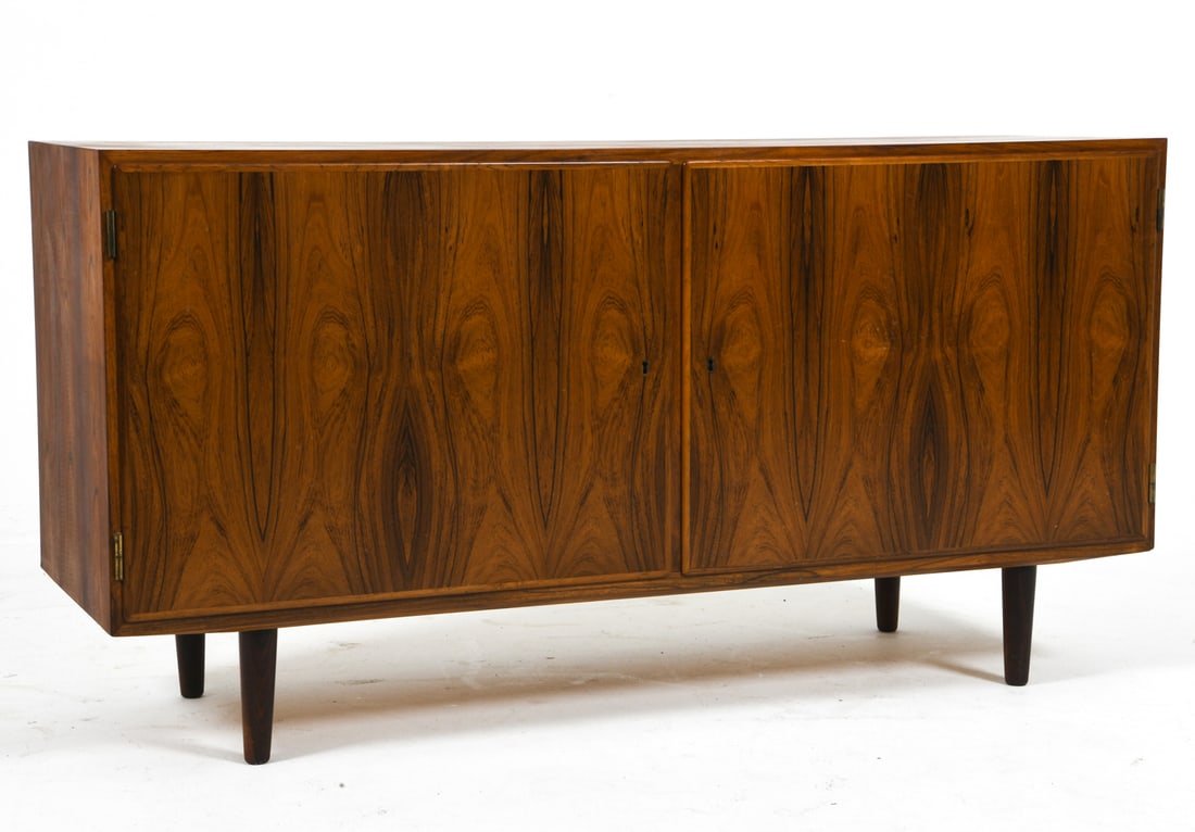POUL HUNDEVAD DANISH ROSEWOOD SIDEBOARD C. 1960S: Key included. Adjustable shelves. Marked to back. Denmark, circa 1960s. Dimensions: H 28" x W 54.5" x D 17". Condition: Minor scuffs and dings, wear consistent with age and use. J019