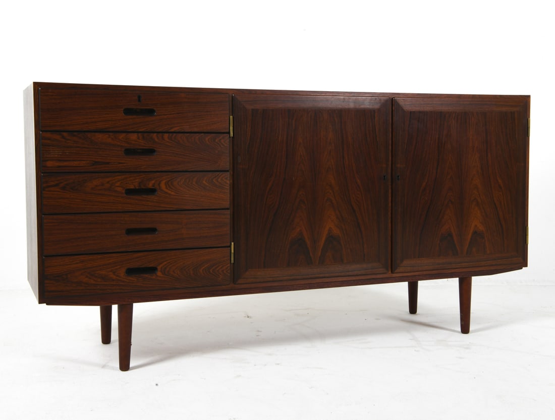 KAI WINDING DANISH ROSEWOOD SIDEBOARD C. 1960S: For P. Jeppesens Mobelfabrik. Key included. Adjustable shelves. Molded inset drawer pulls. Apparently untagged. Denmark, circa 1960s. Dimensions: H 32" x W 64.5" x D 15.5". Condition: Minor scuffs and