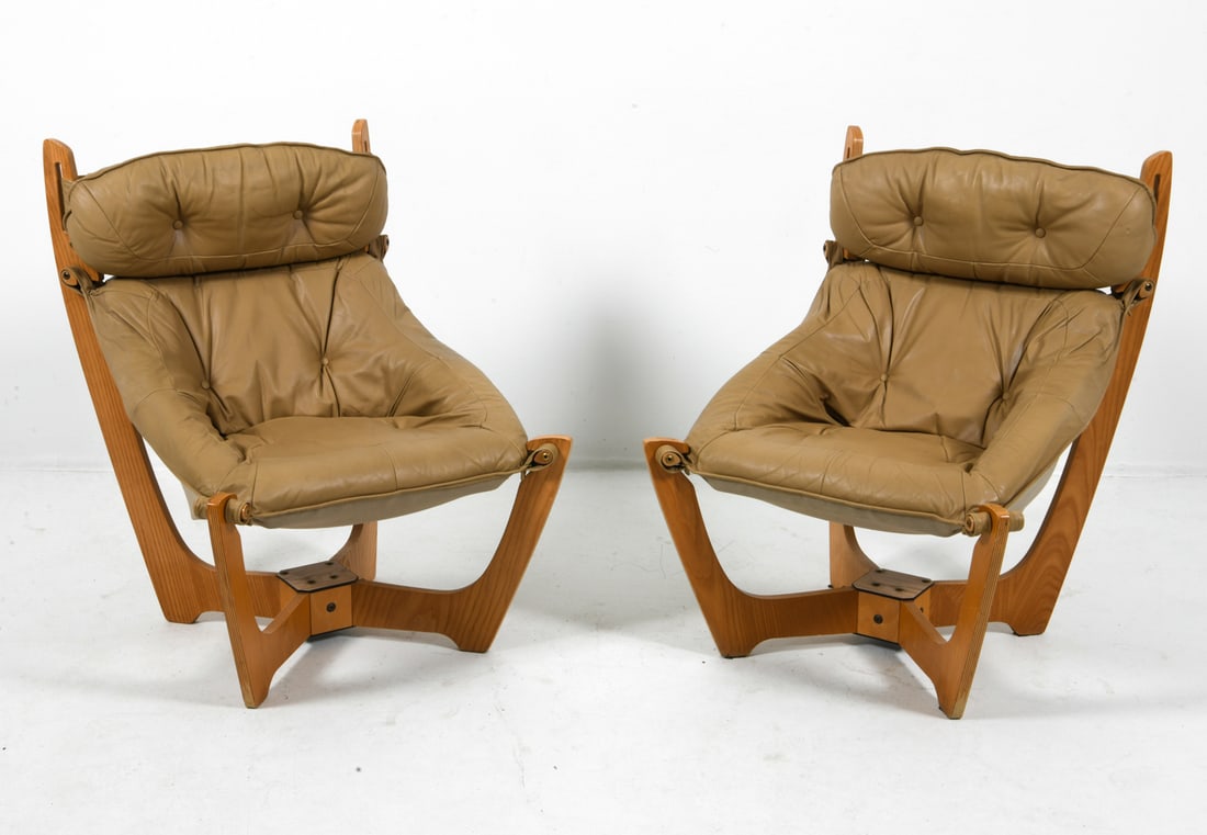 PAIR OF ODD KNUTSEN "LUNA" EASY CHAIRS C. 1970S: For Hjellegjerde. Oak frames with leather sling seats. Linen fabric backing to seats. Apparently unmarked. Norway, circa 1970s. Dimensions: H 37.5" x W 26" x D 28" x SH 16.5". Condition: Few faint scu