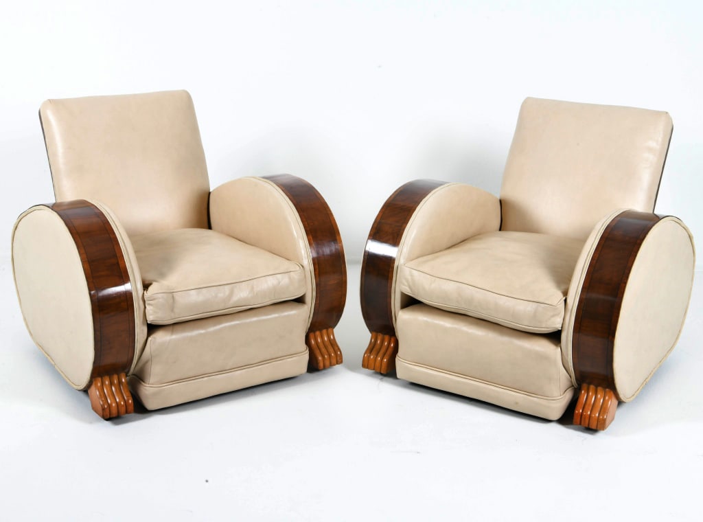 PAIR OF FRENCH ART DECO LEATHER LOUNGE CHAIRS: Rosewood frames with white leather upholstery. On castors. Paw feet. France, circa 1930s. Dimensions: H 32" x W 31.75" x D 31" x SH 10.5". Condition: Some adhesive remnants to arms. Reupholstered in e
