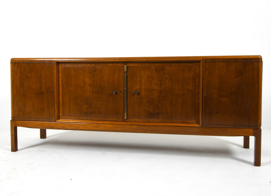 DANISH ART DECO MAHOGANY SIDEBOARD C. 1930S: Key included. Mahogany sideboard with brass accents and drawer pulls. Denmark, circa 1930s. Dimensions: H 32.5" x W 80" x D 21.5". Condition: Showing signs of wear including scratches, scuffs and ding