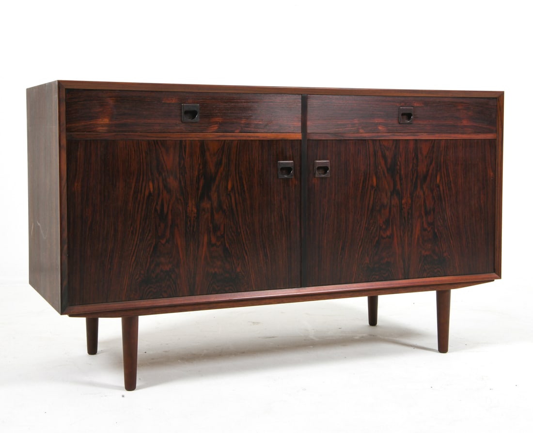 ERIK BROUER DANISH ROSEWOOD SIDEBOARD C. 1960S: Adjustable shelves. Molded inset pulls. Apparently untagged. Denmark, circa 1960s. Dimensions: H 32" x W 53.5" x D 20". Condition: Showing light signs of wear consistent with age and use, including mi