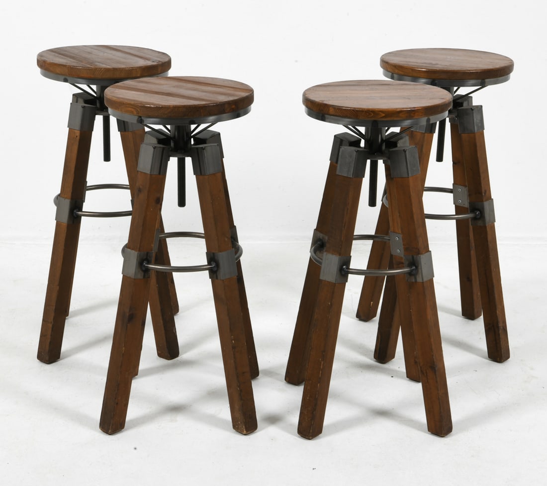 (4) INDUSTRIAL STYLE PINE BAR STOOLS C. 1980S: Pine legs and seats with steel foot bars. Scandinavian, circa 1980s. Dimensions: H 31.5" x Dia. 19.5". Condition: Scuffs and scratches to wood and metal. Wear consistent with age and use. J081