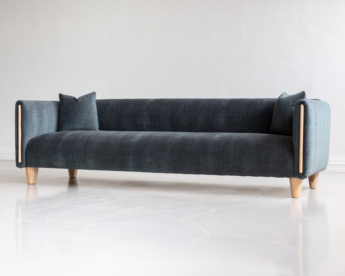 TYLER HAYS FOR BDDW NOBOL MAPLE SOFA: Nobol sofa with two throw pillows in maple frame. Upholstered in BDDW fabric #443. Dimensions: H 27.75" x W 98" x D 37" x Sh 16" Condition: Wear consistent with age and use, including faint rubs, scuf