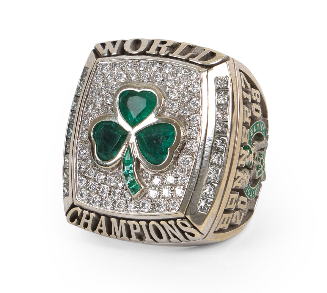 BOSTON CELTICS 2008 CHAMPIONSHIP RING: 2008 Boston Celtics NBA championship ring originally owned by an early team investor. Made of 14-karat white gold and green emeralds forming the logo shamrock on the diamonds. Left shank features