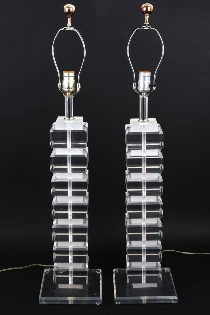 PAIR OF KARL SPRINGER STYLE LUCITE TABLE LAMPS: Stacked clear lucite table lamps in the style of Karl Springer. Apparently unmarked. Dimensions: H 32.25" x W 7.25" x D 7.25" Condition: Wear consistent with age and use. Some scuffs to underside.