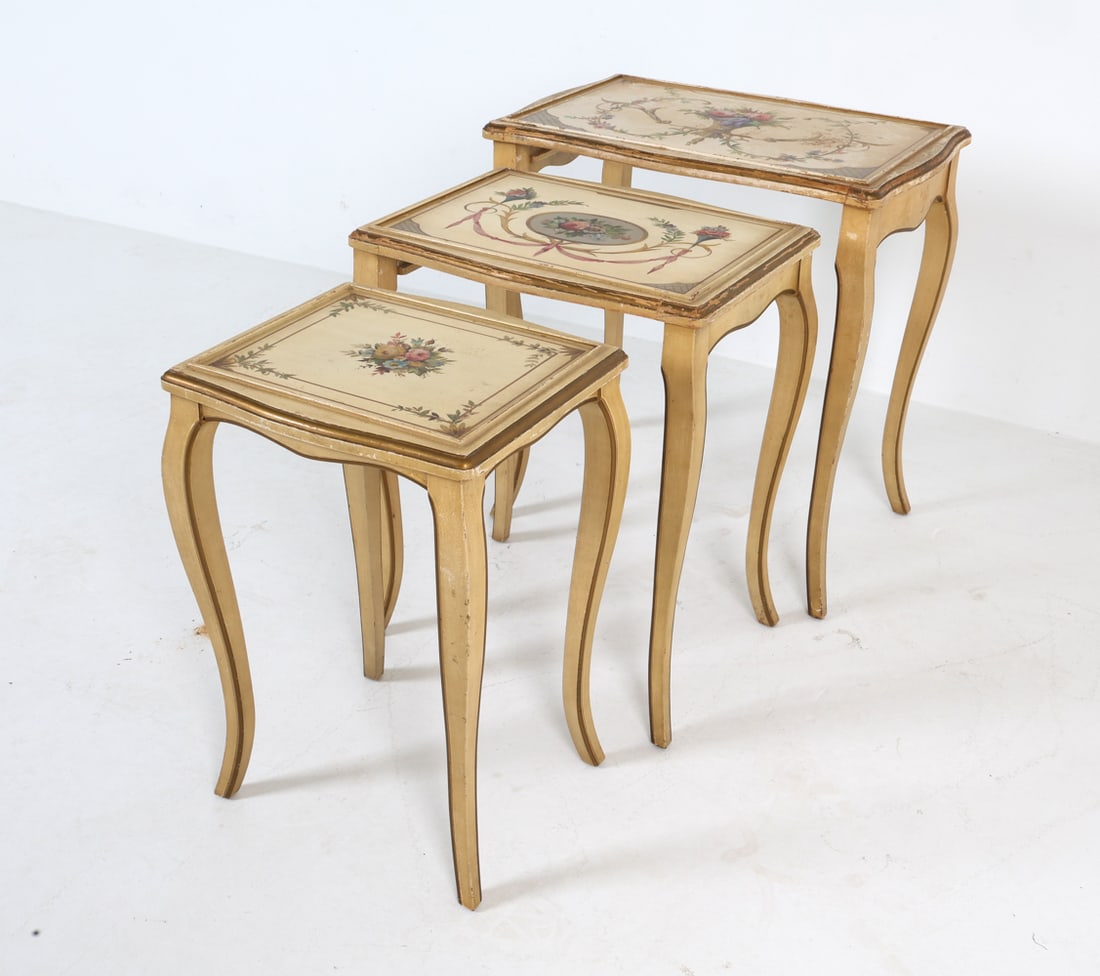 KOZAK STUDIOS PROVINCIAL STYLE NESTING TABLES: Set of (3) painted nesting tables. Carved and painted wood. Mid 20th century. Dimensions: (largest) H 23" x W 21" x D 14.5". Condition: Showing light signs of wear including scratches, scuffs and smal