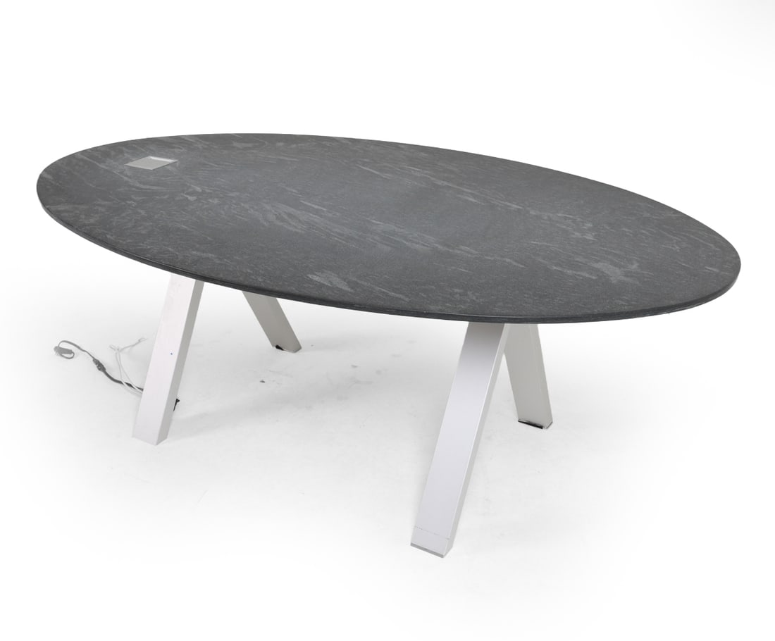 ATTR ERG INTERNATIONAL ASPEN CONFERENCE TABLE: Stone oval top with brushed metal legs. Outlets accessible through slot in top of table. Apparently untagged. Contemporary. Dimensions: H 30" x W 82.5" x D 50.25". Condition: Wiring untested. Minor