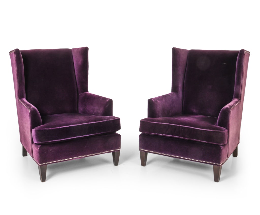 PAIR MITCHELL GOLD & BOB WILLIAMS WINGBACK CHAIRS: Two lounge chairs on dark stained tapered legs. Deep purple velvet upholstery with silver tone metal nailhead trim along the base. Marked to underlining. Dimensions: H 41.75" x W 30.5" x D 38" x SH