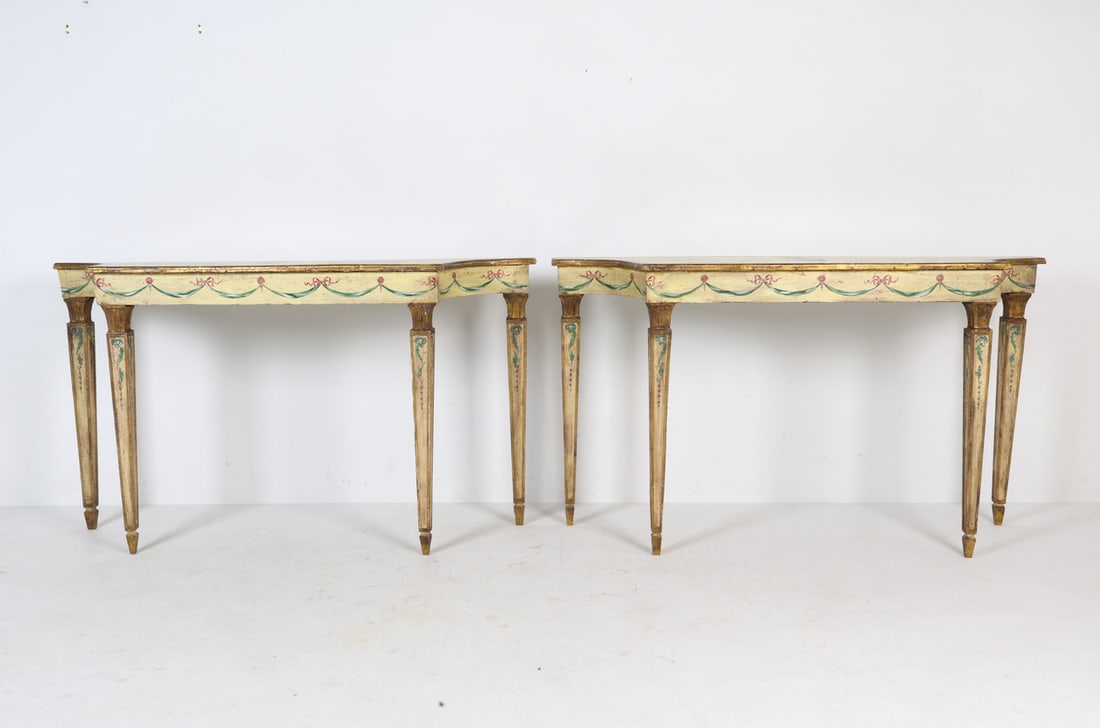 PAIR OF ITALIAN HAND-PAINTED CONSOLE TABLES: (2) Wooden console tables hand-painted in Neoclassical style. Italy, early 20th century. Dimensions: H 34" x W 60" x D 17". Condition: Showing signs of wear including nicks, scratches, some paint loss