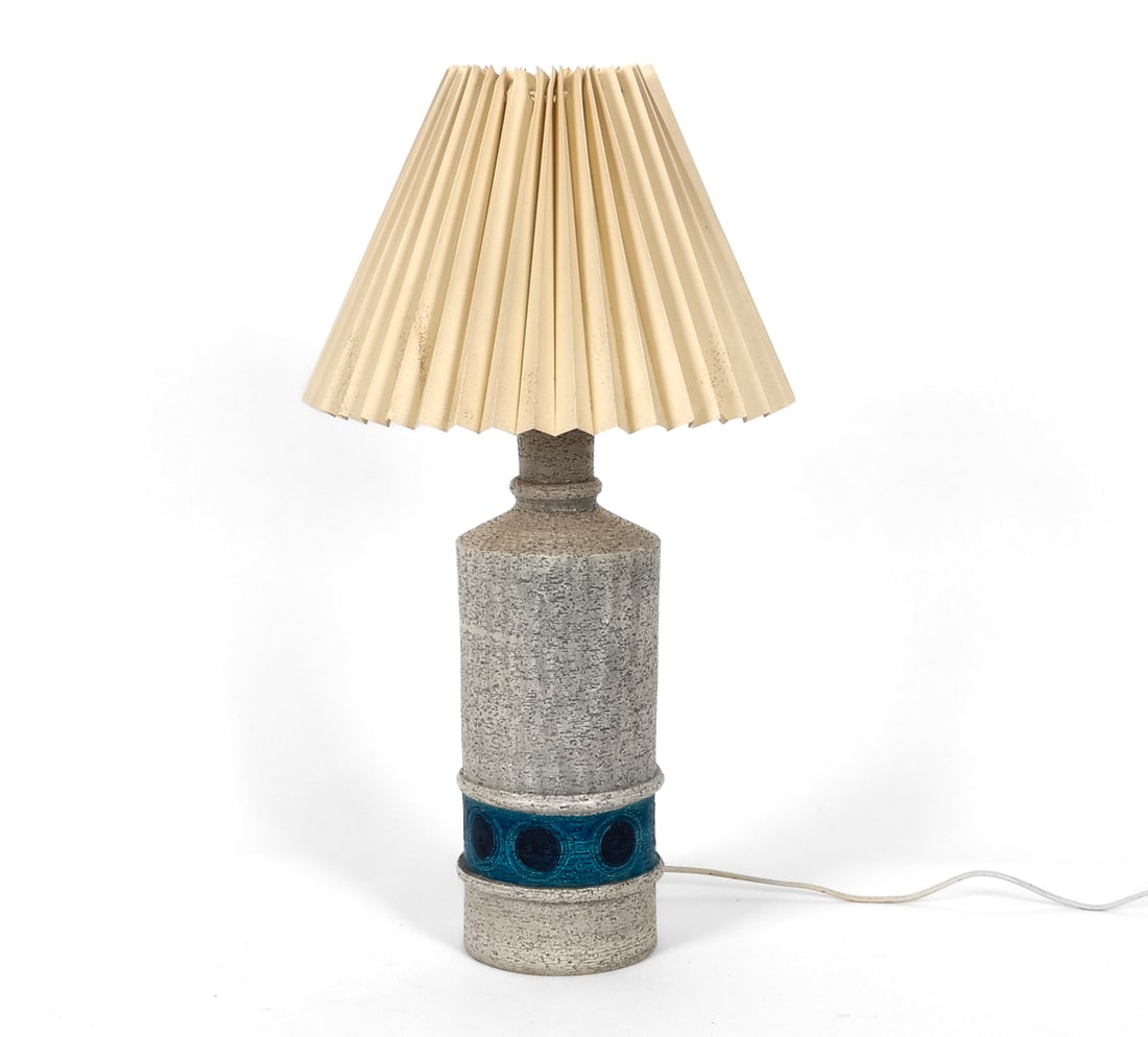 ALDO LONDI FOR BITOSSI CERAMIC TABLE LAMP C. 1970S: Ikano series. Stoneware table lamp in textured grey finish and blue glazed band with incised circular geometric motifs. Marked underneath. Italy, circa 1970s. Dimensions: H 23.25" x Dia. 12.75" Condit