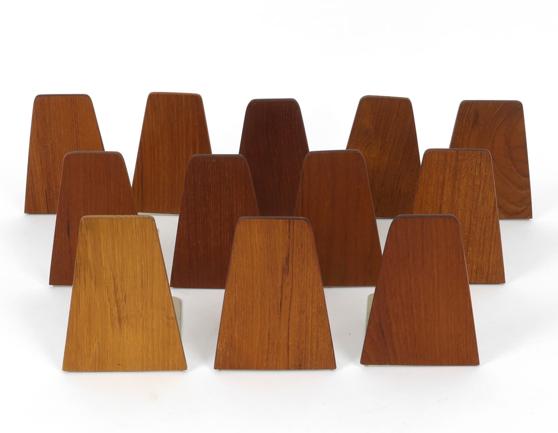 (12) KAI KRISTIANSEN DANISH TEAK BOOKENDS C. 1960S: Grouping of twelve bookends. Apparently unmarked. Denmark, circa 1960s. Dimension: H 5.25" x W 3.75" x D 5.75" Condition: Wear consistent with age and use, including minor rubs and scuffs.
