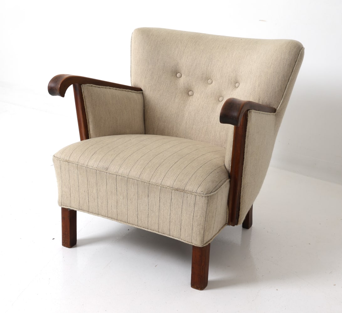 FRITZ HANSEN STYLE DANISH MAHOGANY LOUNGE CHAIR: Danish armchair with curved arms and flared back. Beige stripe upholstery with button tufting. Denmark, circa 1960S. Dimensions: H 28" x W 29" x D 32" x SH 14" Condition: Wear consistent with age and