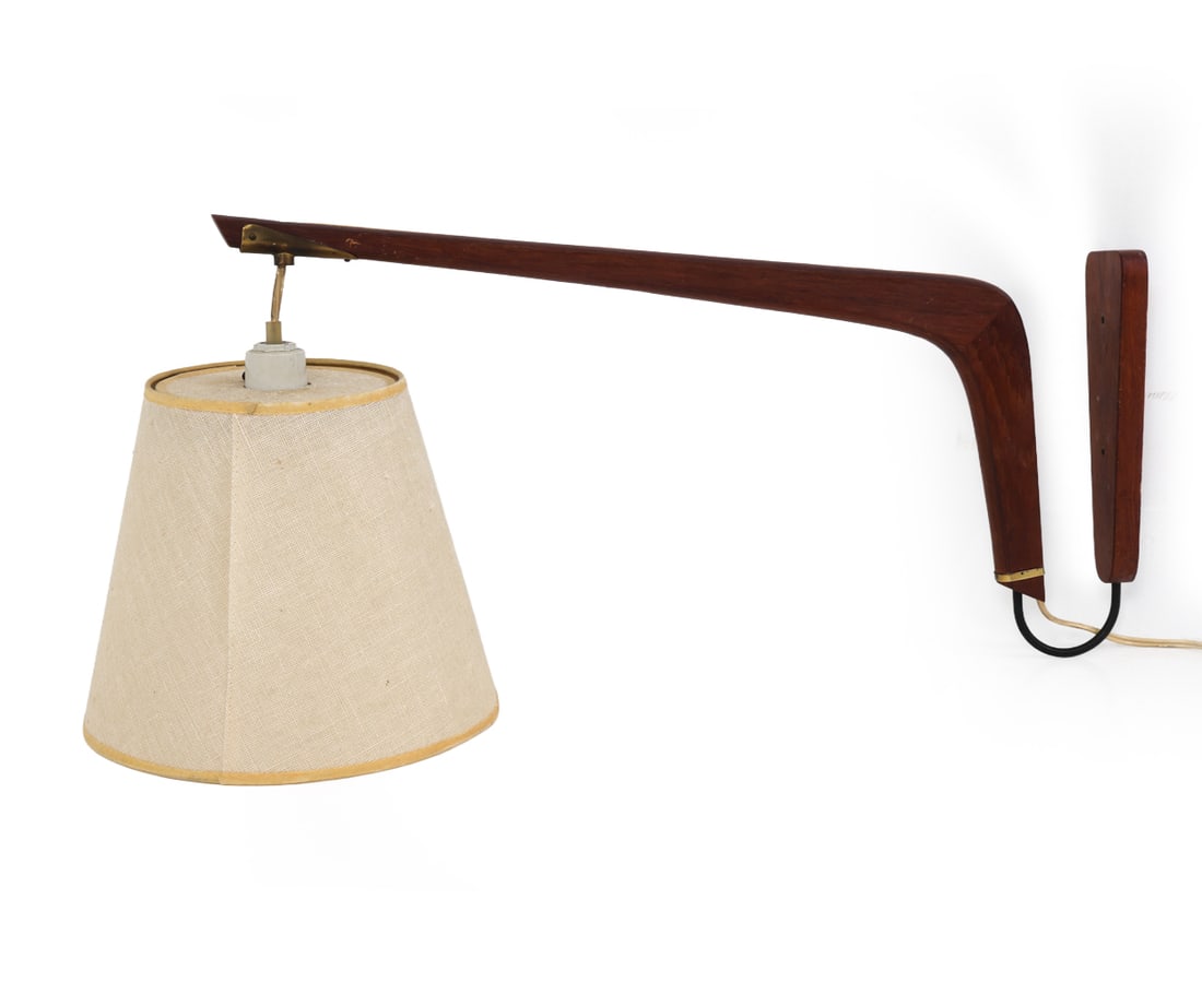 LUXUS STYLE SWEDISH TEAK WALL SCONCE C. 1960S: Teak wall lamp with and brass details and a beige tone shade. Sweden, circa 1960s. Dimensions: H 10" x W 9.75" x D 24" Condition: Not tested, Wear consistent with age and use, including scratches and