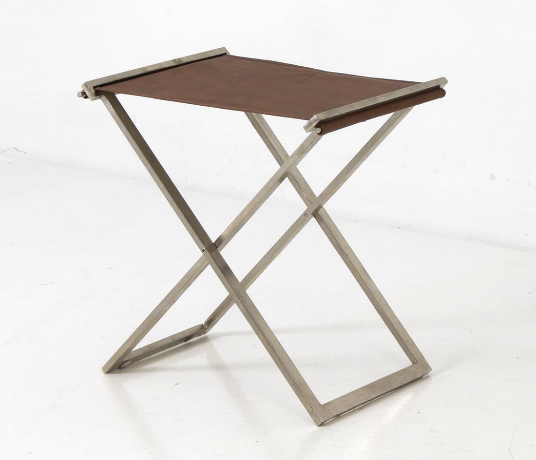 STYLE OF POUL KJAERHOLM DANISH STEEL FOLDING STOOL: Stainless steel frame, with a subtle twist in the metal to allow it to fold. Denmark, circa 1960's. Dimensions: H 20" x W 18.75" x D 15.75" Condition: Wear consistent with age and use including rubs,