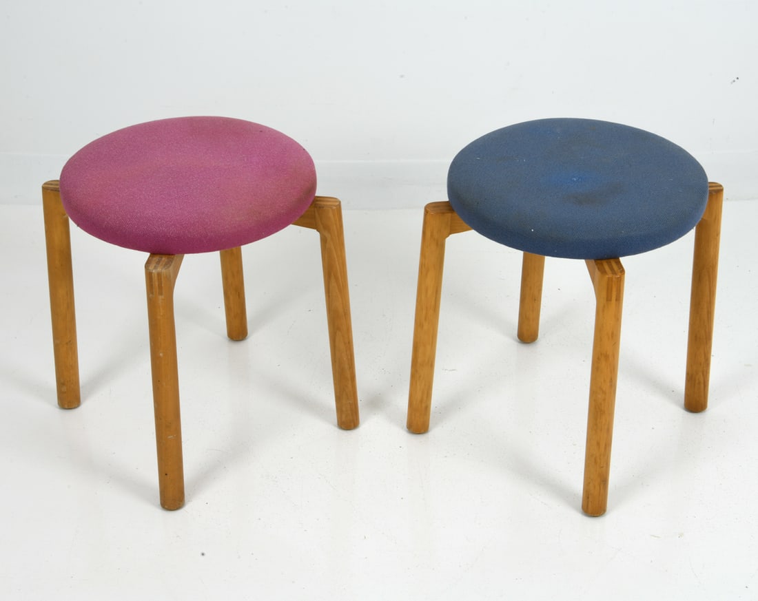 PAIR ERIK KIRKEGAARD FOR HONG DANISH STOOLS: Round stools in beech frame with pink and blue upholstered seats by Hong Stolefabrik. Tagged underneath. Denmark. Dimensions: H 18.5" x Dia 20" Condition: Wear consistent with age and use. Sun fading,