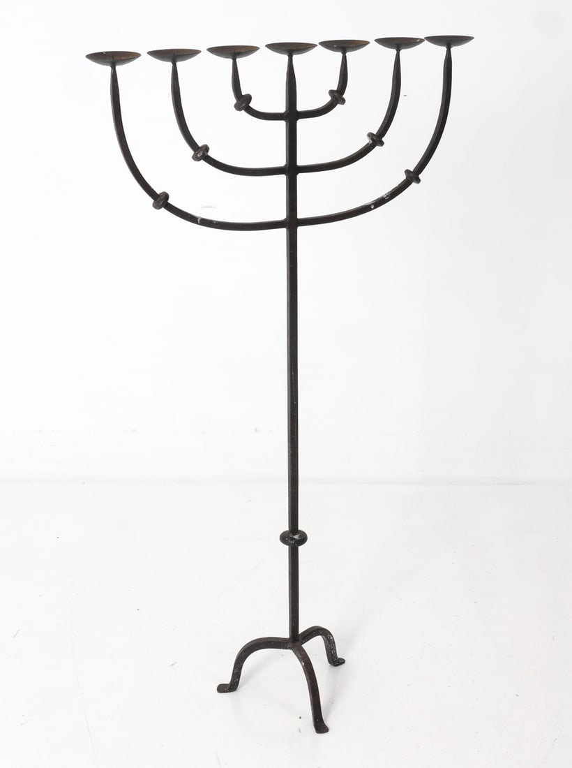 SCANDINAVIAN IRON CANDELABRA 1950S: With 7 candleholders. Circa 1950's. Dimensions: H 47.5" x W 27" x D 8" Condition: Wear consistent with age and use. Oxidizing, wax, scuffs, loss to paint.