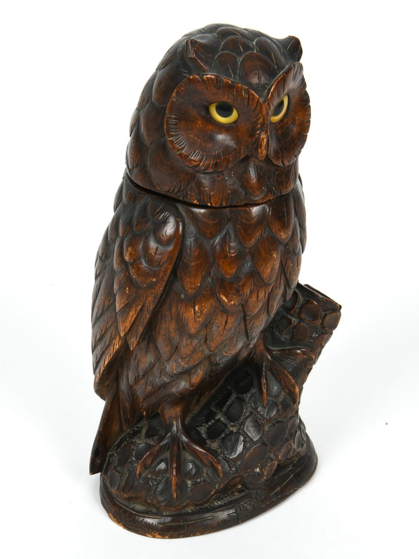 ANTIQUE HAND-CARVED WOODEN OWL BOX OR HUMIDOR: Wooden carved owl with a hinged head that opens up to reveal a small compartment. Dimension: H 11.25" x W 5.75" x D 4.75" Condition: Wear consistent with age and use including minor rubs and scuffs to