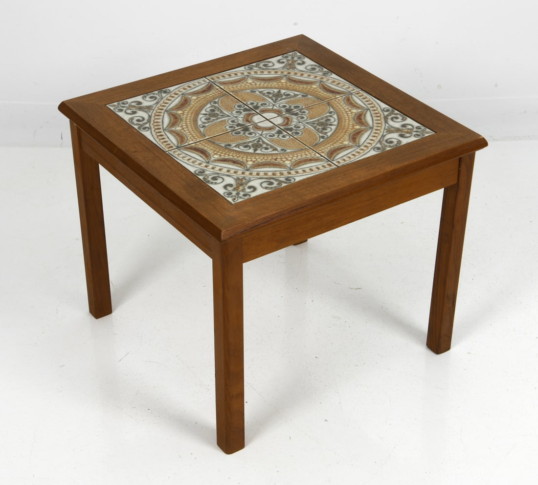 ATTR. TOFTEN DANISH TEAK & TILE SIDE TABLE 1970S: Teak side coffee table with ceramic tile inlay top. Denmark, circa 1970s. Dimensions: H 17.5" x W 20.5" x D 20.5" Condition: Wear consistent with age and use. Scuffs, nicks.