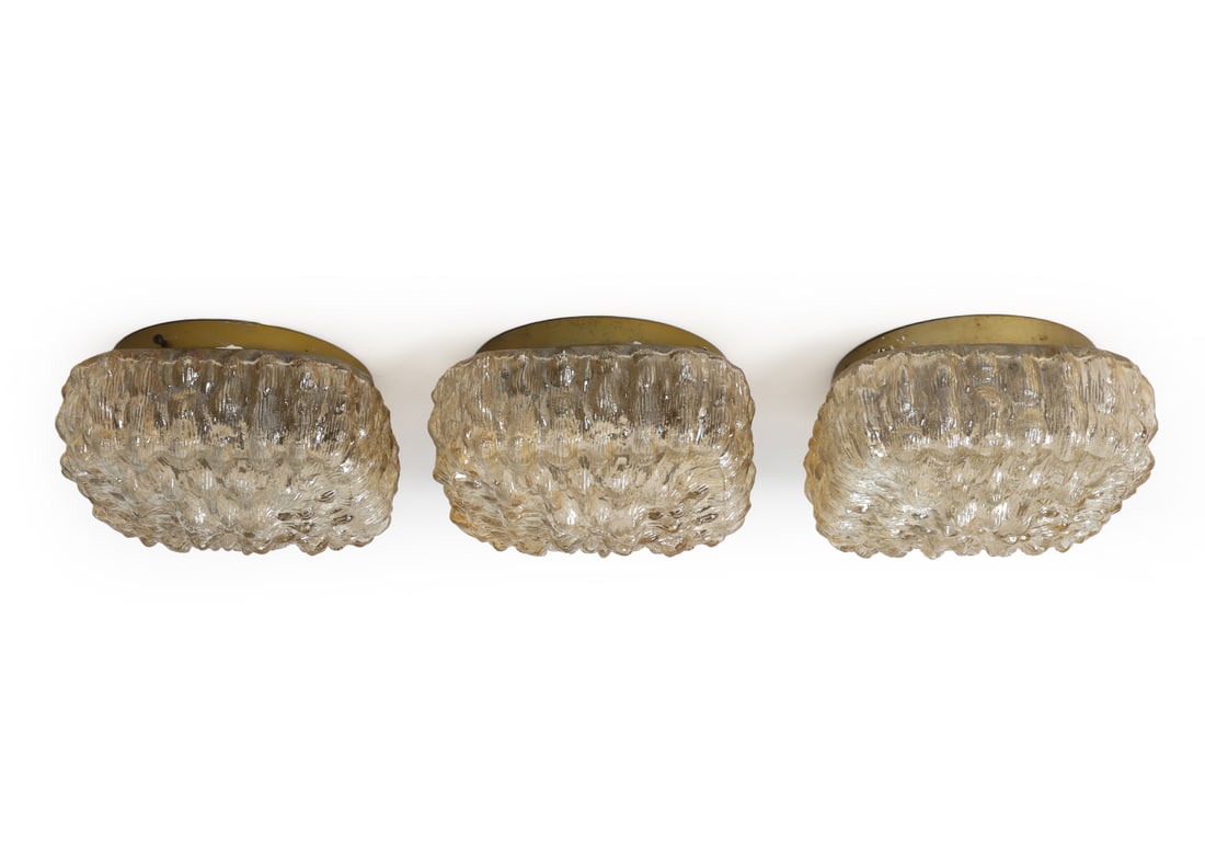 (3) SLG A/S DANISH GLASS CEILING LIGHTS: Three mount ceiling lights in bubble glass shade and gold tone metal frame. Tagged to fixture. Denmark. Dimensions: H 4.5" x W 8" Condition: Wear consistent with age and use. Untested, the cord is cut