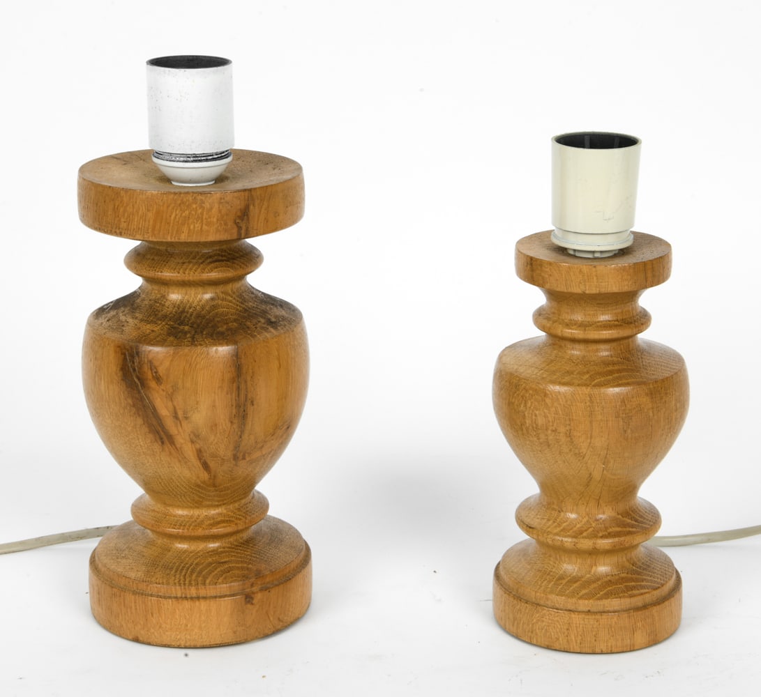 (2) SCANDINAVIAN OAK TABLE LAMPS C. 1970S: Turned spindle shape base with white sockets. Scandinavian, circa 1970s. Dimension: H 10.5" x Dia. 4" Condition: Not tested, Cord cut, Wear consistent with age and use.