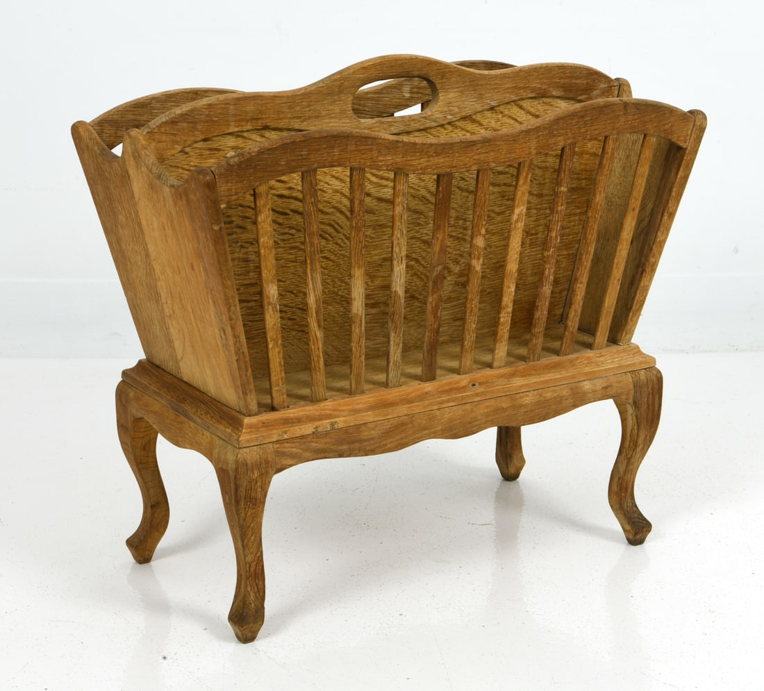 MID-CENTURY DANISH OAK MAGAZINE RACK: Oak magazine rack in a rustic style with two sections and slat sides. Apparently unmarked. Dimensions: H 18.5" x W 21" x D 10" Condition: Moderate discoloration throughout. Wear consistent with age an