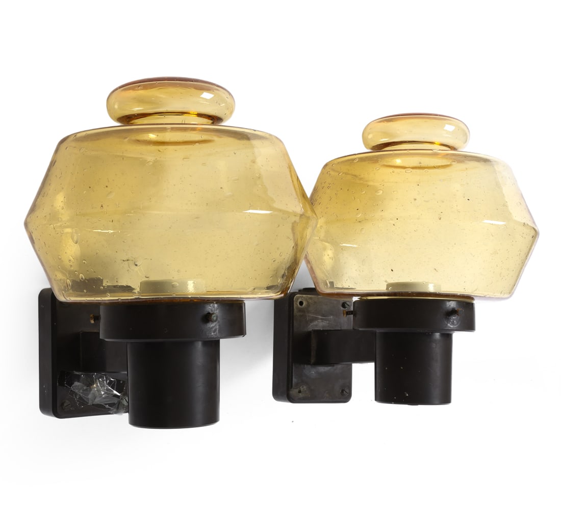 PAIR STYLE OF GUNNAR ASPLUND GLASS WALL SCONCES: Amber glass shade with bubble texture and black plastic structure. Sweden, circa 1960s. Dimension: H 11" x W 8" x D 10.75" Condition: Not tested, Wear consistent with age and use, including scuffs