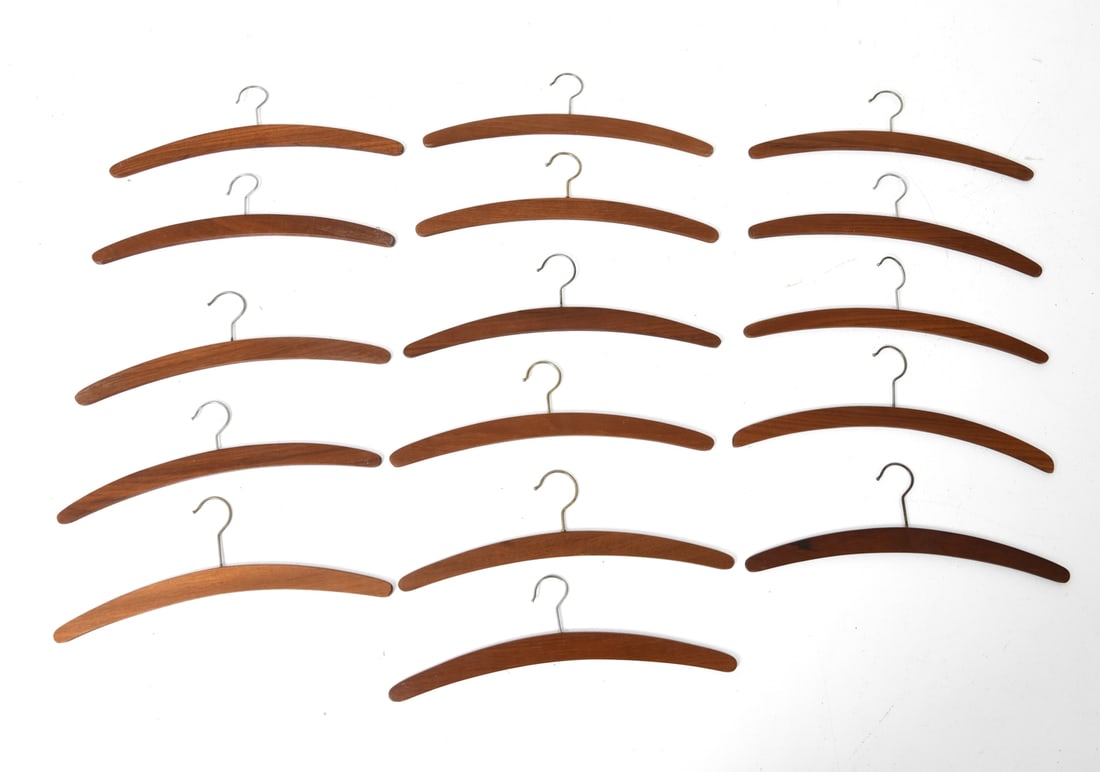 (16) DANISH TEAK HANGERS GROUPING 1960S: 16 teak hangers. Denmark, circa 1960's. Dimension: H 5.5" x W 17.5" Condition: Wear consistent with age and use. Some scuffs.