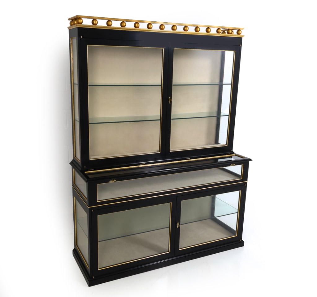SMITH & WATSON EBONIZED DISPLAY VITRINE: Custom made glass vitrine cabinet made by Smith & Watson and Titchmarsh & Goodwin. Display cabinet features a black lacquer frame with gilt features, with glass doors and a solid brass gallery at top.
