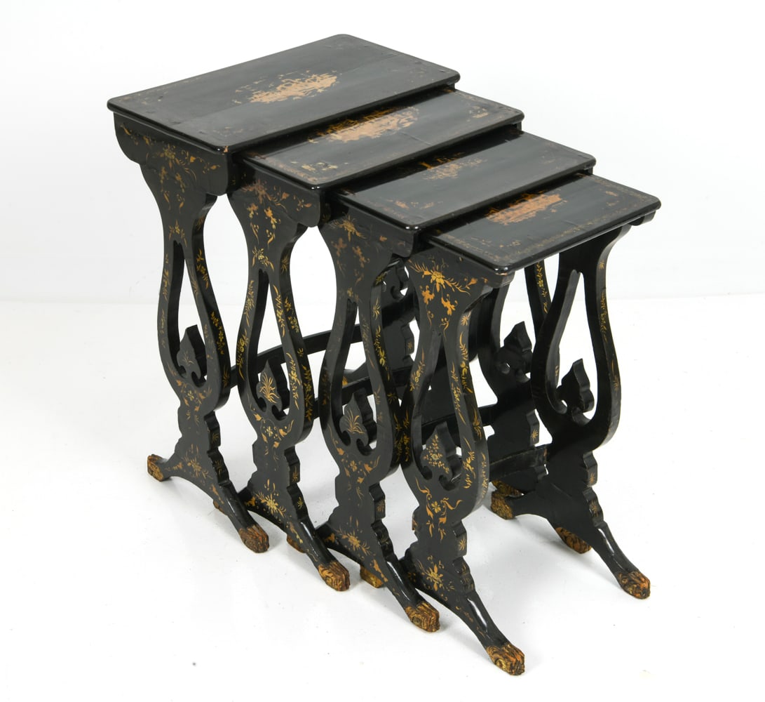 (4) ANTIQUE CHINOISERIE LACQUERED NESTING TABLES: A graduated set of four black lacquer nesting tables with figural palace scenes and floral motifs decoration. Scrolling lyre-form supports in carved paw feet with gilt highlights. European, mid 19th c