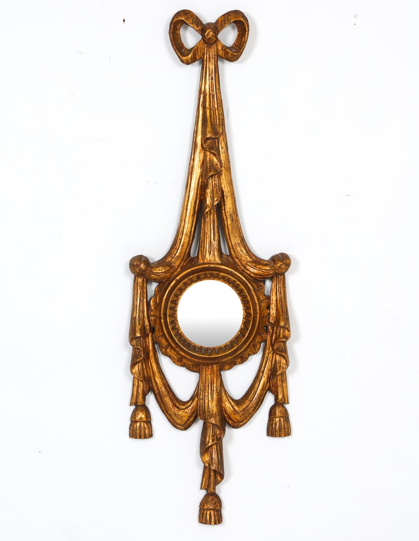 ITALIAN GILT RIBBON WALL MIRROR: Carved and gilt wood. Dimensions: H 35" x W 11" x D 2". Condition: With few stress cracks and slight joint separation to frame. Previous repairs to front. Wear consistent with age and use.