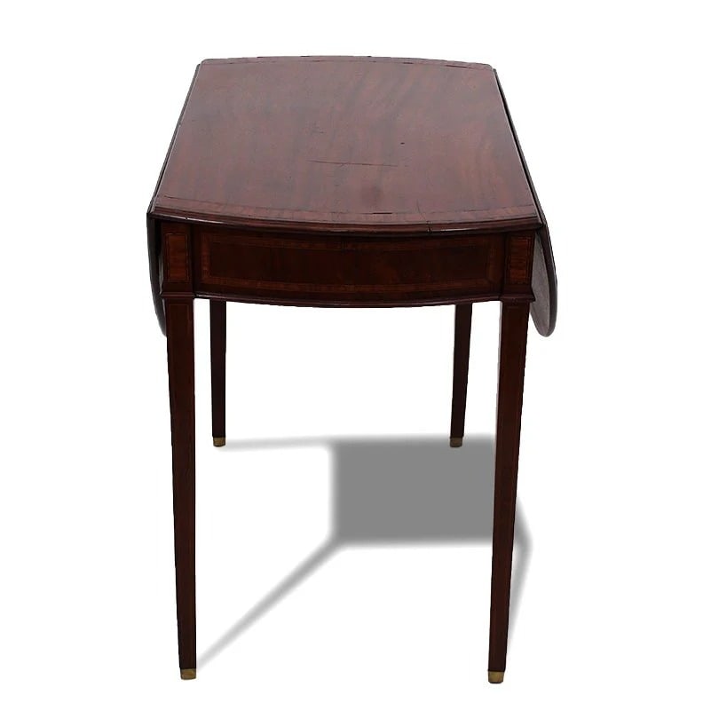 PEMBROKE MAHOGANY DROP-LEAF TABLE: A 19th century table Solid mahogany, nicely detailed with satinwood inlay. Dimensions: H "28" x W "41" x D "32" Condition: Wear consistent with age and use. Scuffs, nicks rubs, some loss to surface.