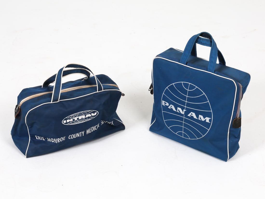 VINTAGE AIRLINE TRAVEL BAGS GROUPING INCL PAN AM: Includes (2) travel bags from Northwest Orient and Panam. Dimensions: Largest H 12" x W 12" x D 4.5". Condition: Minor scuffs and rubs, wear consistent with age and use.