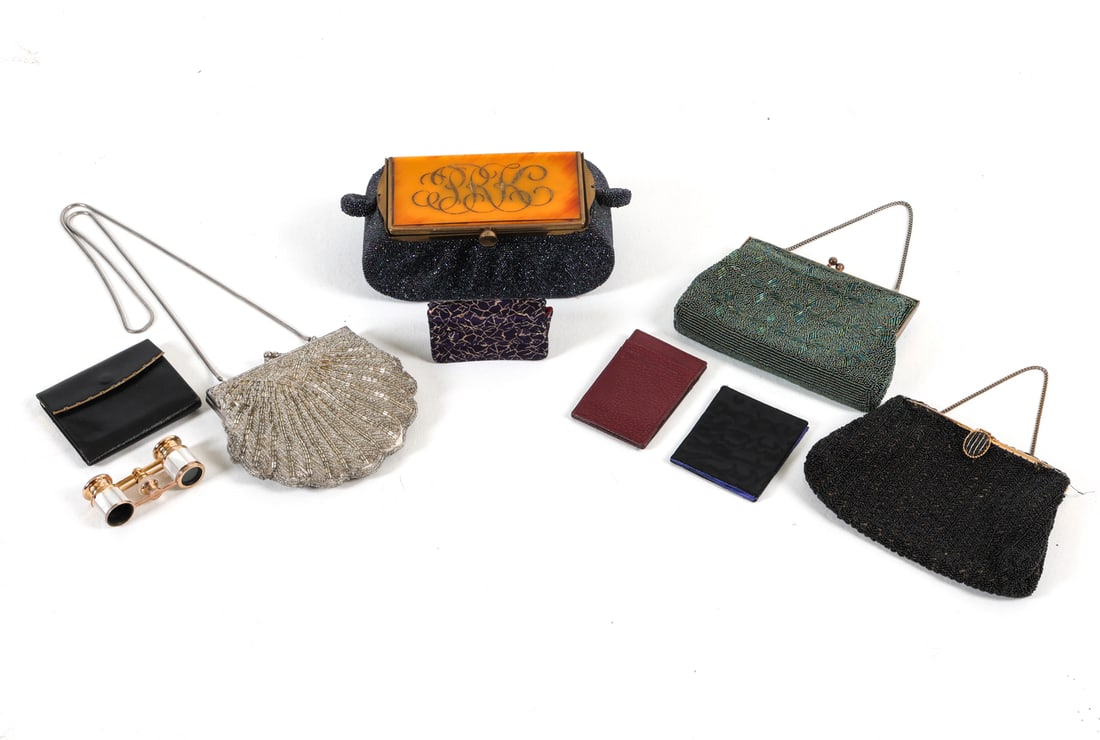 VINTAGE BEADED PURSE GROUPING: Grouping of vintage beaded purses together with small pair of binoculars. Circa 1940s. Dimensions: Largest Purse H 4" x W 8" x D 4". Condition: Minor losses to beads, few frayed edges. Wear consistent