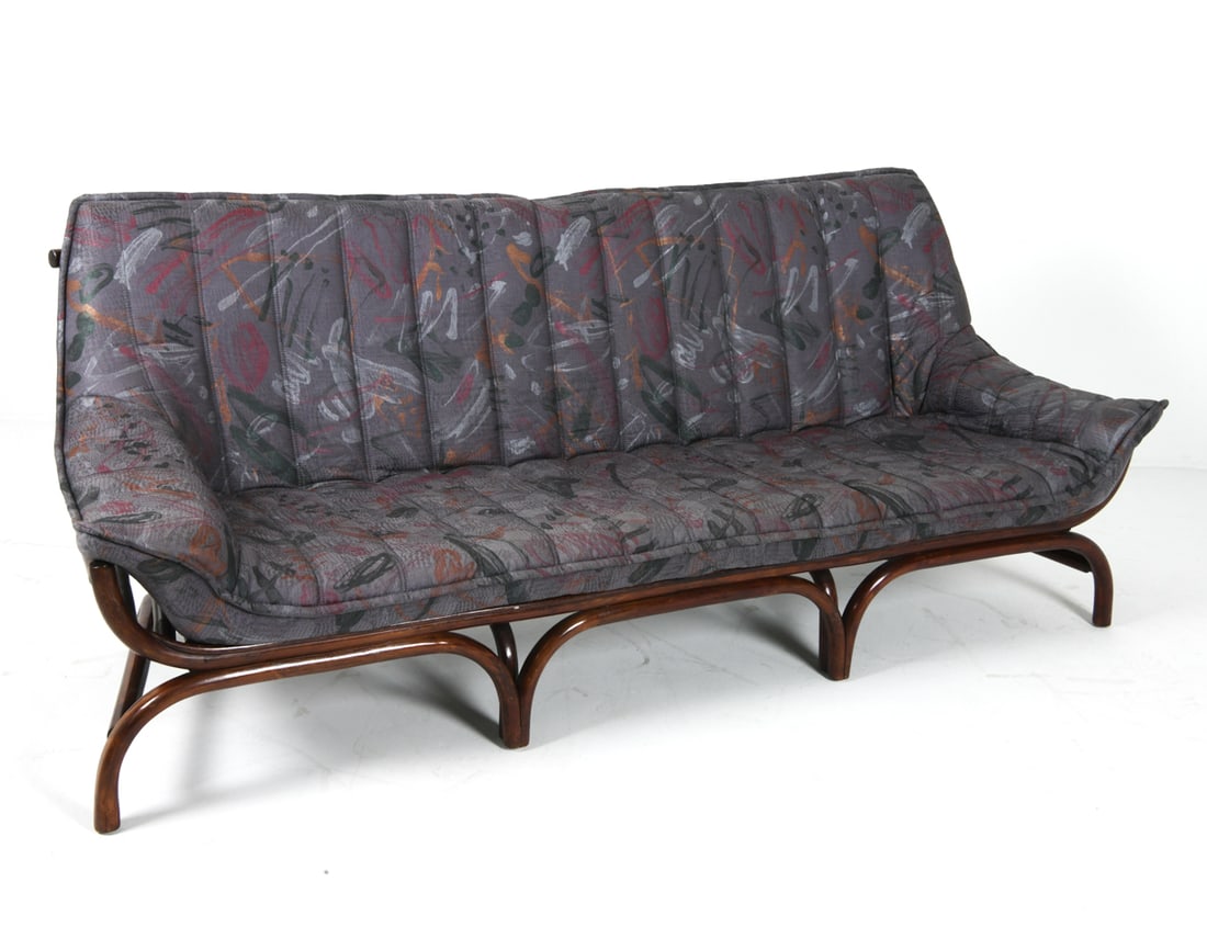 SLETTVOLL STYLE SCANDINAVIAN BAMBOO SOFA C. 1970S: Bamboo frame with abstract pattern upholstered cushions. Scandinavian, circa 1970s. Dimensions: H 31" x W 85" x D 31" x SH 18". Condition: Scuffs, rubs and scratches to bamboo frame, wear consistent w