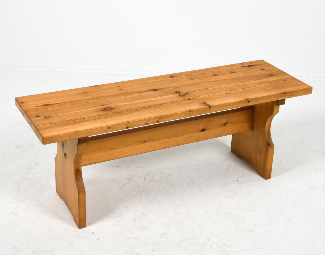 SCANDINAVIAN PINE BENCH C. 1970S: Pine plank top and legs with a stretcher. Scandinavian, circa 1970s. Dimensions: H 17" x W 45.25" x D 14.5". Condition: Minor dings and rubs to surface of wood, Wear consistent with age and use. GERT