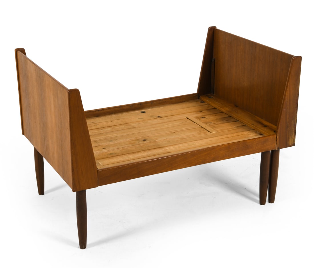 HEVALI FABRIK DANISH TEAK EXTENDING BED C.1960S: Teak children bed frame on tapered legs. Sculpted corners and rounded edges. Apparently unmarked. Denmark, circa 1960s. Dimensions: H 27.5" x W 27.5" x D 41.25". Condition: Extension feature requires
