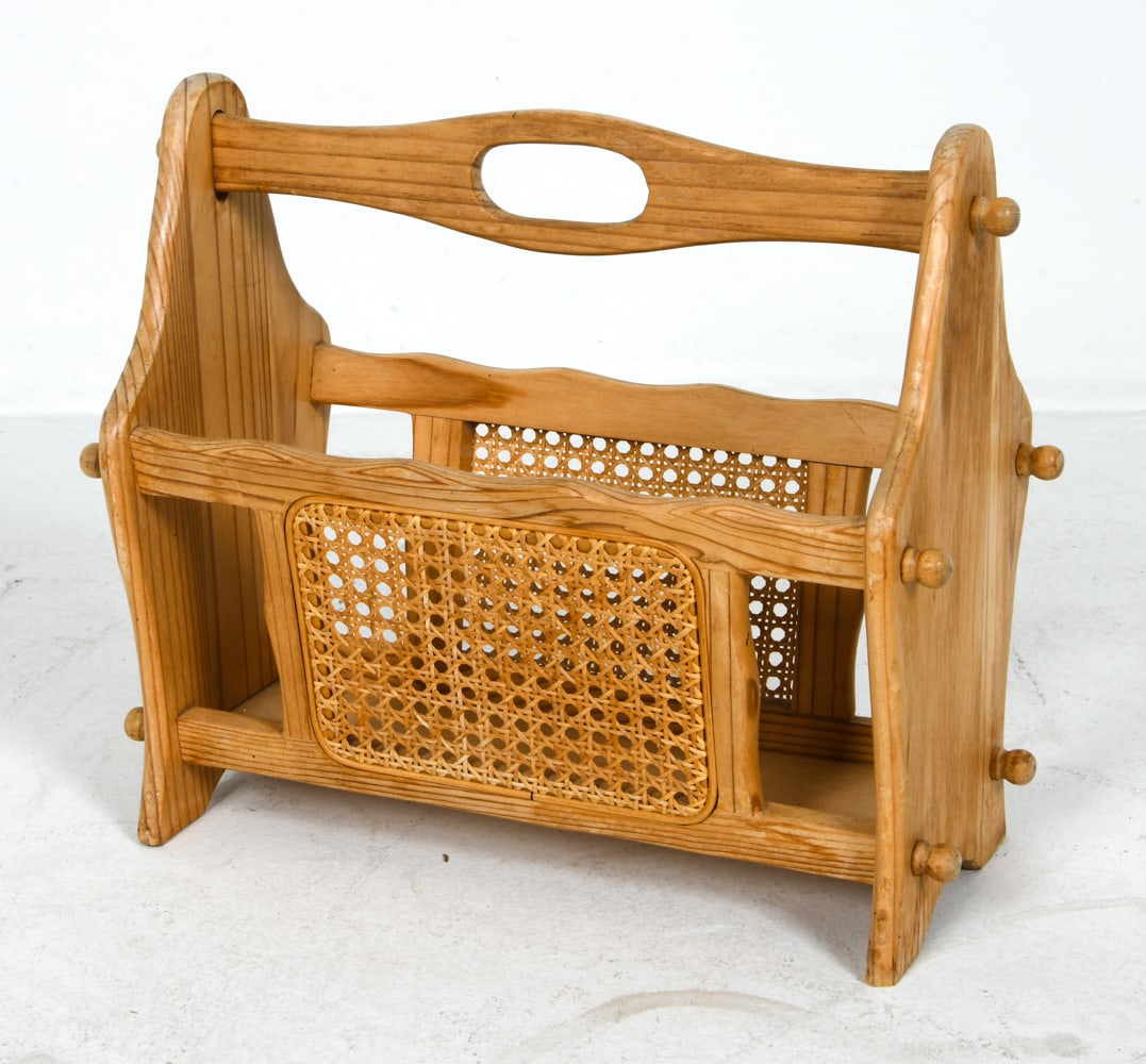 SWEDSIH PINE & CANE MAGAZINE RACK C. 1970S: Dimensions: H 15.25" x W 17.5" x D 9". Condition: Scuffs and scratches, wear consistent with age and use.