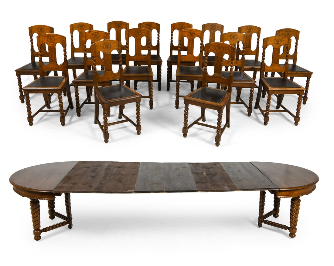 (16) ANTIQUE SCANDINAVIAN DINING CHAIRS & TABLE: (8) Leaves included. Oak expanding dining table together with (16) chairs. Barley twist legs and carved lettering to seat backs. Leather upholstered seats. Early 20th century. Dimensions: Chairs H 39.