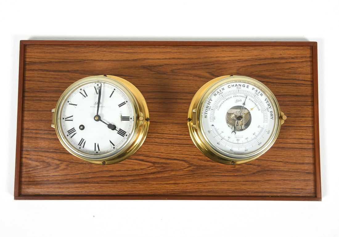 SCHATZ BRASS SHIPS CLOCK & BAROMETER: Brass ship's clock and barometer affixed to oak plinth. Marked to dials. Dimensions: H 12.5" x W 23.5". Condition: Timekeeping and atmospheric reading untested. Minor scuffs to plinth. Wear consistent