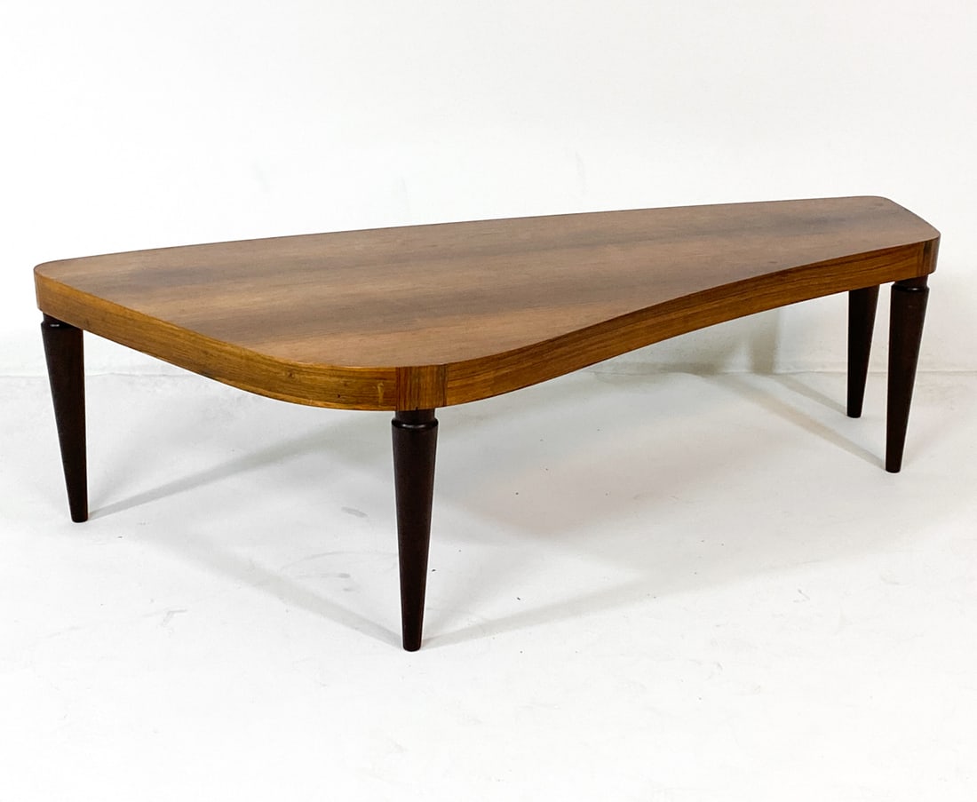 DANISH ATOMIC STYLE ROSEWOOD COFFEE TABLE 1960S: Rosewood coffee table with kidney-shaped top. Denmark, circa 1960s. Dimensions: H 20" x W 72" x D 34". Condition: Few faint water spots to top. Wear consistent with age and use. V030