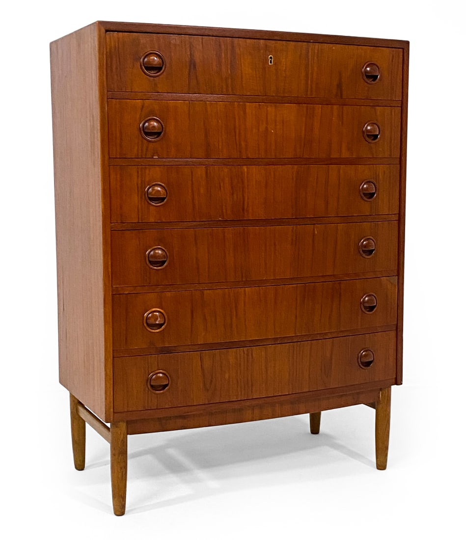 DANISH TEAK BOW-FRONT CHEST OF DRAWERS: Key included. Bow-front teak chest with molded inset drawer pulls. Denmark, circa 1970s. Dimensions: H 43" x W 31" x D 17". Condition: Water spots and discolored areas to top. Few small dings. Wear co