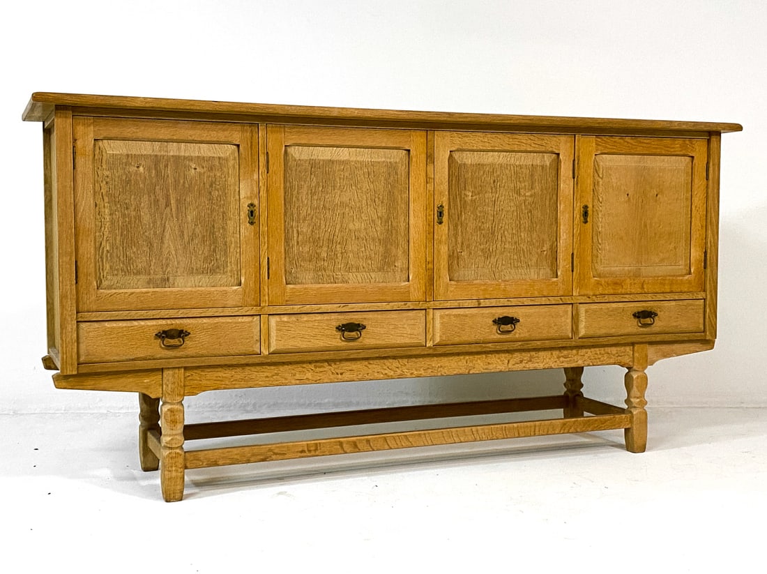 HENNING KJAERNULF STYLE DANISH OAK SIDEBOARD: Key included. Adjustable shelves. Felt lined drawers. Denmark, circa 1970s. Dimensions: H 40.5" x W 82" x D 19.5". Condition: Few water rings inside. Wear consistent with age and use. V038