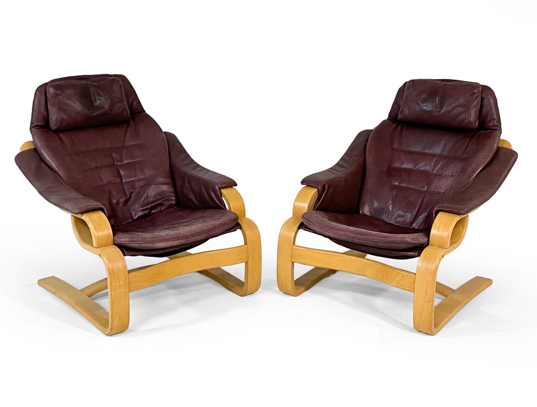 PAIR OF SVEND SKIPPER 'APOLLO' LOUNGE CHAIRS: From Skipper Mobler. Tagged underneath to legs. Beech bentwood frames with brown leather upholstery. Denmark, circa 1970s. Dimensions: H 34.5" x W 30" x D 34" x SH 14.5". Condition: Leather faded on e