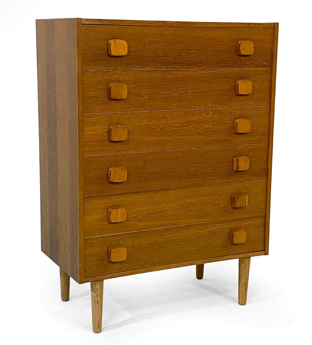 DANISH OAK CHEST OF DRAWERS C. 1970S: Oak chest of drawers with square drawer pulls. Denmark, circa 1970s. Dimensions: H 42" x W 30" x D 16.5". Condition: Shallow gouge to top. Slight sun fading. Wear consistent with age and use. V124