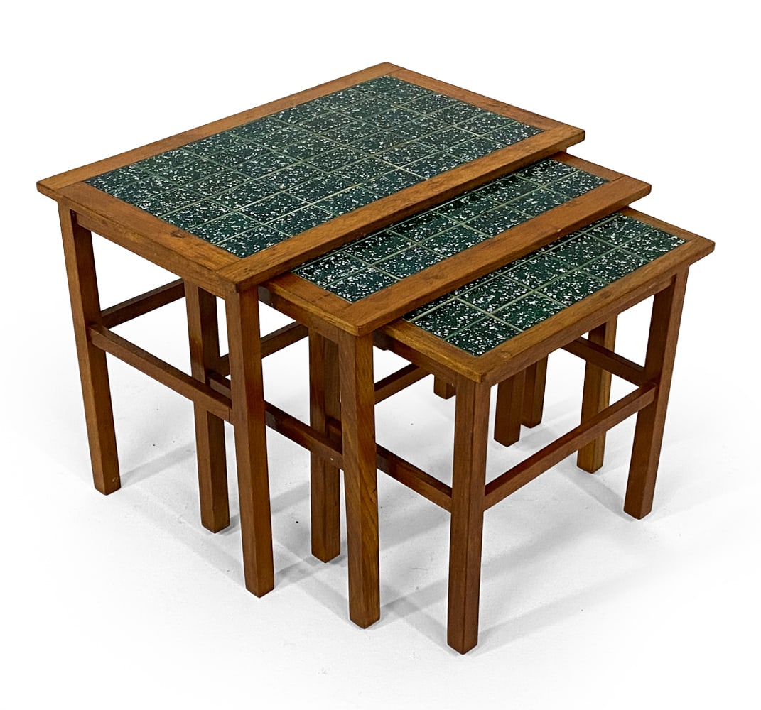 DANISH TEAK & CERAMIC TILE NESTING TABLES C. 1970S: (2) Teak nesting tables with green ceramic tiles inlaid to tops. Denmark, circa 1970s. Dimensions: Largest H 18.5" x W 24" x D 15". Condition: Scuffs and scratches, few water spots to wood. Wear consi